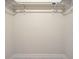 Inside the walk-in closet with hanging rods at 9310 Rosebud Cir, Port Charlotte, FL 33981