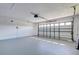 Spacious two-car garage with automatic door and plenty of room for parking and storage, offers convenience and security at 9310 Rosebud Cir, Port Charlotte, FL 33981