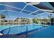 Screened-in pool with waterfront views at 9310 Rosebud Cir, Port Charlotte, FL 33981