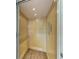Modern elevator with light wood-paneled walls and floors, with illuminated lighting overhead at 611 W Olympia Ave, Punta Gorda, FL 33950