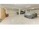 Expansive garage featuring ample space, epoxy flooring, and room for multiple vehicles at 611 W Olympia Ave, Punta Gorda, FL 33950