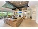 Bright living room with hardwood floors, fireplace, and access to outdoor balcony at 611 W Olympia Ave, Punta Gorda, FL 33950