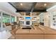 Inviting living room with fireplace, hardwood floors, and lots of natural light at 611 W Olympia Ave, Punta Gorda, FL 33950
