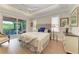 Serene main bedroom with hardwood floors and balcony access at 611 W Olympia Ave, Punta Gorda, FL 33950