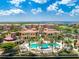 Aerial view of community pool, water features, and resort-style amenities at 97 Vivante Blvd # 9727/207, Punta Gorda, FL 33950