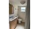 Clean and bright bathroom with updated vanity and toilet at 3100 Harbor Blvd # 116, Port Charlotte, FL 33952