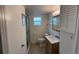 Clean bathroom, shower stall, toilet and modern vanity at 3100 Harbor Blvd # 116, Port Charlotte, FL 33952