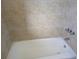 Bathroom with bathtub and beige tile surround at 3100 Harbor Blvd # 116, Port Charlotte, FL 33952