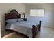 Main bedroom with double bed and ample natural light at 3100 Harbor Blvd # 116, Port Charlotte, FL 33952