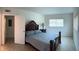 Main bedroom with a double bed and tile floors at 3100 Harbor Blvd # 116, Port Charlotte, FL 33952