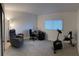 Home office or bedroom with a recliner, desk, and exercise bike at 3100 Harbor Blvd # 116, Port Charlotte, FL 33952