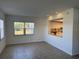 Bright dining area with kitchen pass-through and tile flooring at 3100 Harbor Blvd # 116, Port Charlotte, FL 33952