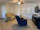 Relaxing living room with reclining chairs and tiled floor at 3100 Harbor Blvd # 116, Port Charlotte, FL 33952