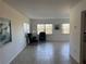 Living room with tile floors and artwork on the walls at 3100 Harbor Blvd # 116, Port Charlotte, FL 33952