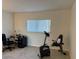 Home office with a desk, chair, and exercise bike at 3100 Harbor Blvd # 116, Port Charlotte, FL 33952