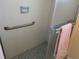 Simple shower with grab bar and tiled walls at 3100 Harbor Blvd # 116, Port Charlotte, FL 33952
