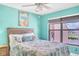 Serene bedroom with light teal walls and a full-size bed at 3256 White Ibis Ct # 13B, Punta Gorda, FL 33950