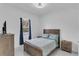 Bright bedroom with natural light, wood furnishings, and soft bedding at 13454 Ingraham Blvd, Port Charlotte, FL 33981