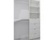 Organized walk-in closet with built-in shelving and drawers for optimal storage solutions at 13454 Ingraham Blvd, Port Charlotte, FL 33981