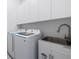 Clean laundry room with modern appliances and ample storage space at 13454 Ingraham Blvd, Port Charlotte, FL 33981