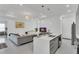 Spacious living room featuring contemporary decor, recessed lighting, and sleek gray furnishings at 13454 Ingraham Blvd, Port Charlotte, FL 33981