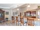 Kitchen island with seating and granite countertops at 2556 Saturday St, North Port, FL 34288