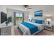 Main bedroom with a king-size bed and large window with ocean view at 42392 Cascade Dr, Punta Gorda, FL 33982