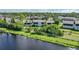 Aerial view of a condo building overlooking a tranquil waterway at 4260 Placida Rd # 15D, Englewood, FL 34224