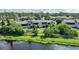 Aerial view of a condo building with water access, showcasing its serene setting at 4260 Placida Rd # 15D, Englewood, FL 34224