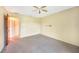 Spacious bedroom with carpet and access to hallway at 4260 Placida Rd # 15D, Englewood, FL 34224