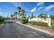 Community entrance with palm trees and a Forest Park sign at 4260 Placida Rd # 15D, Englewood, FL 34224