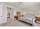 Bright bedroom with ensuite bathroom and a comfortable bed at 1289 Ballota Ln, North Port, FL 34289