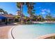 Relaxing resort-style pool with spacious deck and clubhouse view at 1289 Ballota Ln, North Port, FL 34289