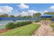 Tennis courts with seating area and shade structure at 1289 Ballota Ln, North Port, FL 34289