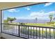 Stunning water view from private balcony, showcasing blue skies and lush landscape at 1500 Park Beach Cir # 2F, Punta Gorda, FL 33950