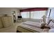 Spacious bedroom with a queen-size bed and ensuite bathroom at 22580 Bolanos Ct, Port Charlotte, FL 33952