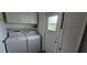 Bright laundry room, washer, dryer, cabinets and exterior access at 22580 Bolanos Ct, Port Charlotte, FL 33952