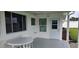 Covered patio with a table and chairs, ideal for outdoor dining at 22580 Bolanos Ct, Port Charlotte, FL 33952