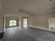 Spacious living room with tile flooring and high ceilings at 49 Tee View Rd, Rotonda West, FL 33947