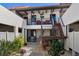 Inviting courtyard featuring well-maintained landscaping, seating areas, and stairs to the upper level condos at 754 Avenida Estancia # 160, Venice, FL 34292