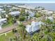 Neighborhood view showcasing a home with a metal roof near the waterfront at 116 Dolly St, Punta Gorda, FL 33950