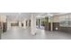Expansive basement with gray flooring and access to the pool area at 116 Dolly St, Punta Gorda, FL 33950