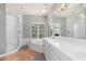 Elegant bathroom with a large soaking tub, double vanity, and walk-in shower at 116 Dolly St, Punta Gorda, FL 33950