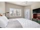 Bright bedroom with a king-size bed, private balcony access, and water views at 116 Dolly St, Punta Gorda, FL 33950