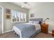 Bright bedroom with a comfortable bed and window shutters at 116 Dolly St, Punta Gorda, FL 33950