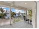 Relaxing deck overlooking the street and tropical neighborhood at 116 Dolly St, Punta Gorda, FL 33950