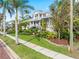 Two-story home with a beautifully landscaped front yard at 116 Dolly St, Punta Gorda, FL 33950