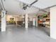 Large garage with epoxy flooring and plenty of storage solutions at 116 Dolly St, Punta Gorda, FL 33950