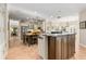 Modern kitchen with dark wood island and white cabinetry at 116 Dolly St, Punta Gorda, FL 33950