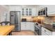 Bright kitchen with stainless steel appliances and white cabinets at 116 Dolly St, Punta Gorda, FL 33950